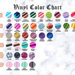 May include: A vinyl color chart displays various colors and finishes, including Opal, Sparkle, Metallic Chrome, Glass Flower, and Shimmer series. Colors range from Opal White to Black Shimmer, with text labels for each color. The chart is on a white marble background.