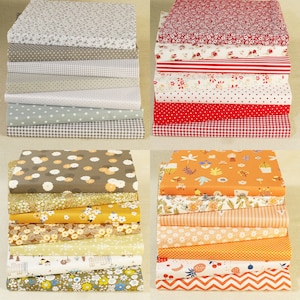 May include: A stack of 10 different fabric squares with various floral and geometric patterns in shades of red, orange, yellow, brown, and gray. The fabric squares are arranged in two stacks of five.