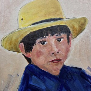 May include: Oil painting portrait of a person wearing a yellow hat and a blue shirt. The person has dark hair and a neutral expression. The background is a light beige color.
