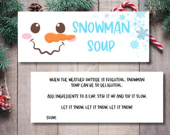 May include: A white printable gift tag with a snowman face and the text "Snowman Soup". The tag also includes instructions for making the soup, such as adding ingredients to a cup, stirring it up, and sipping it slow. The tag ends with the phrase "Let it snow, let it snow, let it snow!" and a space for a name.