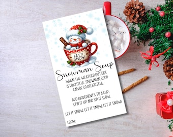 May include: A printable gift tag featuring a snowman in a red mug with the text "Let it Snow". The tag reads "Snowman Soup" and includes instructions for making the soup.