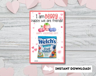 May include: A pink and white Valentine's Day card with the text "I am berry happy we are friends!" and a cartoon image of a strawberry, blueberries, and cherries. The card also includes a picture of a Welch's Fruit Snacks bag.