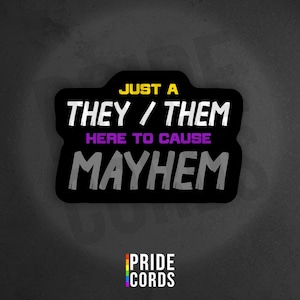 May include: A black sticker with the text "JUST A THEY / THEM HERE TO CAUSE MAYHEM" in white, purple, and gray. The sticker also includes the Pride Cords logo at the bottom, with a rainbow-colored design.