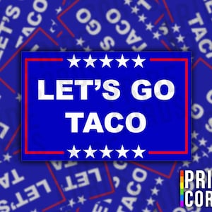 May include: A blue rectangular sticker with the text "LET'S GO TACO" in white, framed by a red border and adorned with white stars. The background features a pattern of similar stickers.