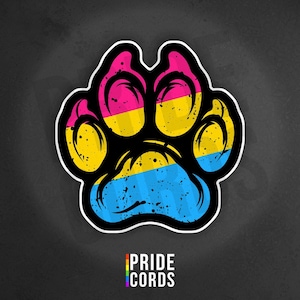 May include: A sticker featuring a paw print in the colors of the pansexual pride flag: pink, yellow, and blue. The paw print has a distressed, textured appearance with a black outline. The text "PRIDE CORDS" is at the bottom.