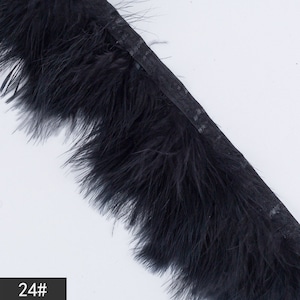 May include: Black feather trim with a black ribbon backing. 24#