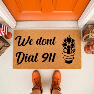 We Don't Dial 911 Doormat - Bold Home Defense Welcome Mat