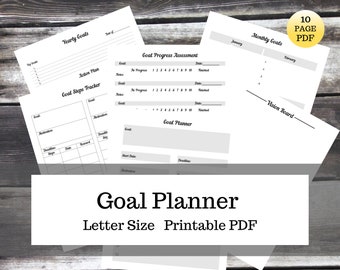 May include: A printable goal planner PDF with 10 pages. The planner includes sections for yearly goals, monthly goals, goal steps tracker, goal progress assessment, and a vision board.