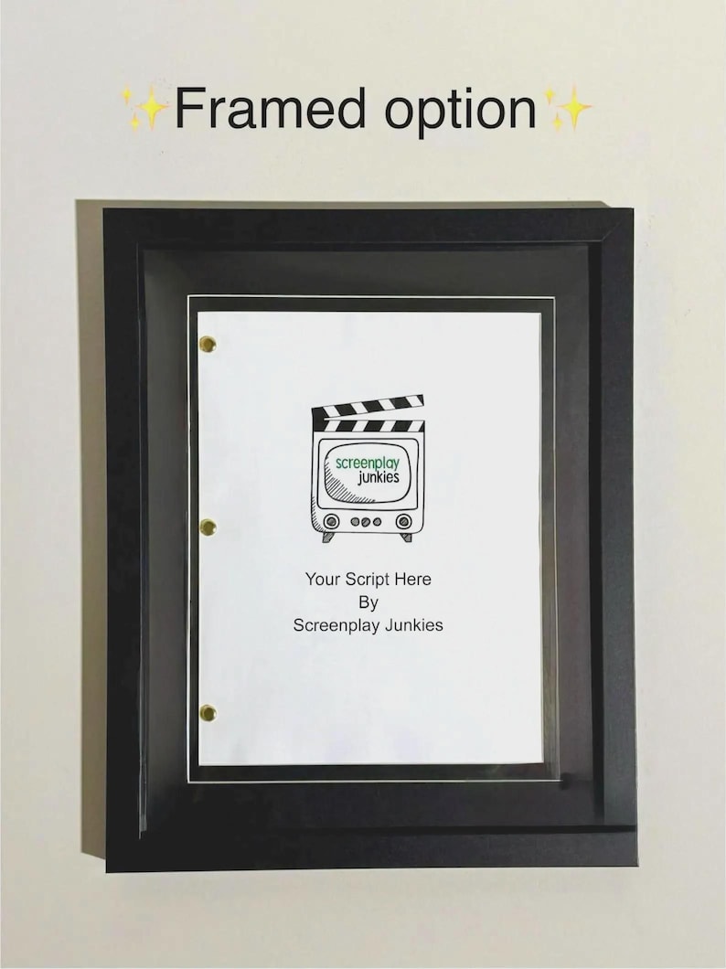 May include: A framed document with a black frame. The document features a film clapperboard design with the text "screenplay junkies" and the words "Your Script Here By Screenplay Junkies". The frame is mounted on a white wall.