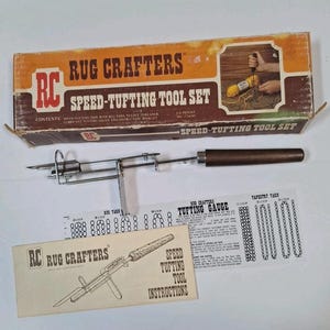May include: A vintage "Rug Crafters Speed-Tufting Tool Set" with a brown and orange box. The set includes a metal and wood tufting tool, instructions, and a tufting gauge. The box reads "Speed-Tufting Tool Set" and "Rug Crafters".
