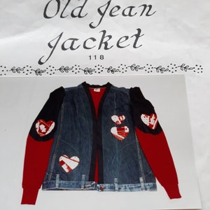 May include: A denim jacket with red sleeves and black trim. The jacket has a red heart design on each sleeve and three red hearts on the front. The jacket is labeled "Old Jean Jacket 118".