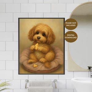 May include: A framed print featuring a golden-brown puppy with a fluffy coat, sitting on a pinkish-brown bed. The puppy is holding a piece of cheese. The background is a soft, warm yellow.