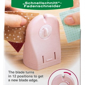 May include: A pink thread cutter with a rotating blade that turns in 12 positions to get a new blade edge. The packaging includes the text "Quick Cut" Thread Cutter, Cutter à Fils "Coupe Vite", Cúter para Hilos "Corte Rápido", "Schnellschnitt"- Fadenschneider, and Clover Mfg. Co., Ltd.