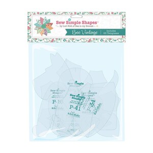 May include: A package of quilting templates labeled "Sew Simple Shapes" by Lori Holt. The package includes 65 templates and features the text "Bee Vintage". The templates are clear plastic and various shapes.