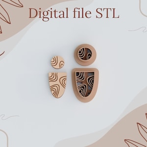Peut inclure: Trois emportes-pièces en bois avec un motif en spirale. Les emportes-pièces sont en forme de cercle, d'un petit ovale et d'un grand ovale.