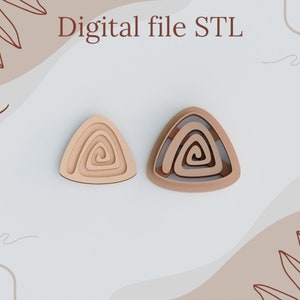 May include: Two wooden triangle shapes with a spiral design. The shapes are layered to create a 3D effect. Digital file STL.