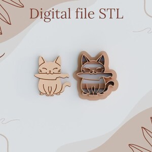 May include: Two wooden cat cookie cutters, one with a striped pattern and the other with a plain design. Both cats are holding a knife in their mouths. The text "Digital file STL" is written above the cutters.