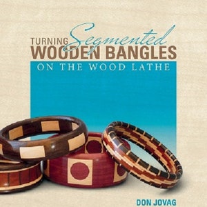 May include: A collection of segmented wooden bangles in various designs and colors, including dark brown, red, and natural wood tones. The image also features a book cover with the title "Turning Segmented Wooden Bangles on the Wood Lathe" and the author's name, Don Jovag.