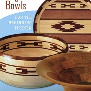 May include: The cover of a book titled "Segmented Bowls" features three wooden bowls with intricate designs. The bowls are made of light and dark wood, with geometric patterns. The text "For the Beginning Turner" is also visible.