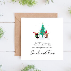 Handgefertigte personalisierte Weihnachtskarte für Sohn und Schwiegertochter mit Pinguinen