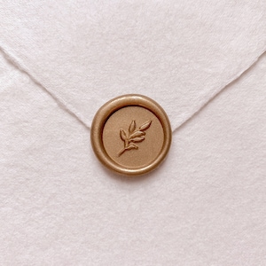 Leaf design mini gold wax seal on white handmade paper envelope