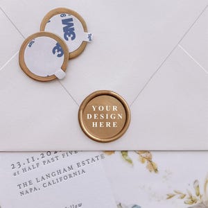May include: Round gold wax seals with adhesive backings. One seal is attached to a white envelope, displaying the text YOUR DESIGN HERE. Two additional seals are shown with 3M adhesive tape labels visible. A wedding invitation card is partially visible.