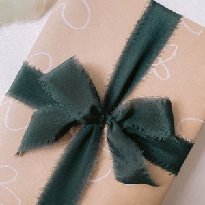 Gift wrapped in Christmas Silk Ribbon in Dark Green close up