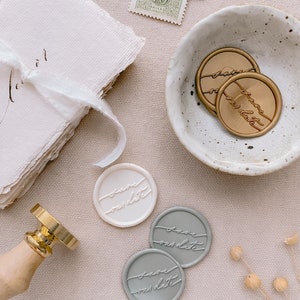 Calligraphy script Save our Date wax seals in gold, off-white and sage, styled with dried flower, ceramic dish and place cards