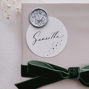 Christmas ornaments silver wax seal on holiday gift wrap
