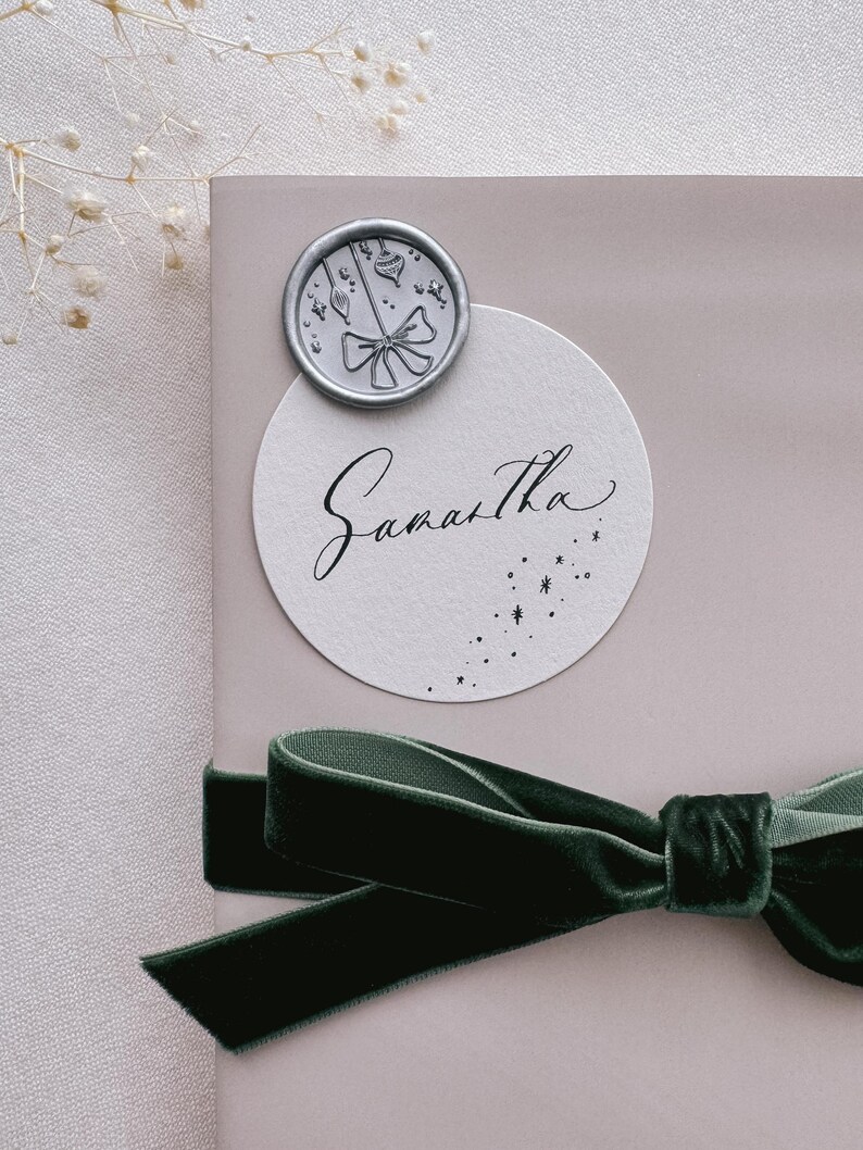 Christmas ornaments silver wax seal on holiday gift wrap