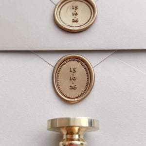 Custom date with border design gold wax seals on white envelopes