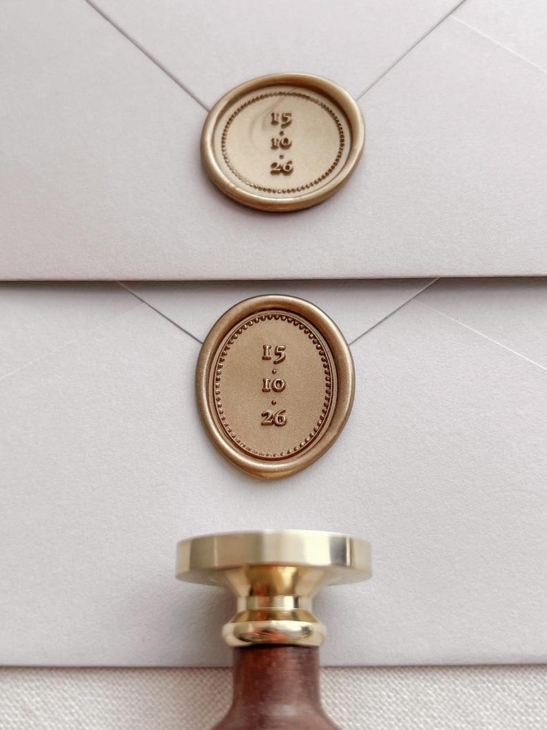 Custom date with border design gold wax seals on white envelopes
