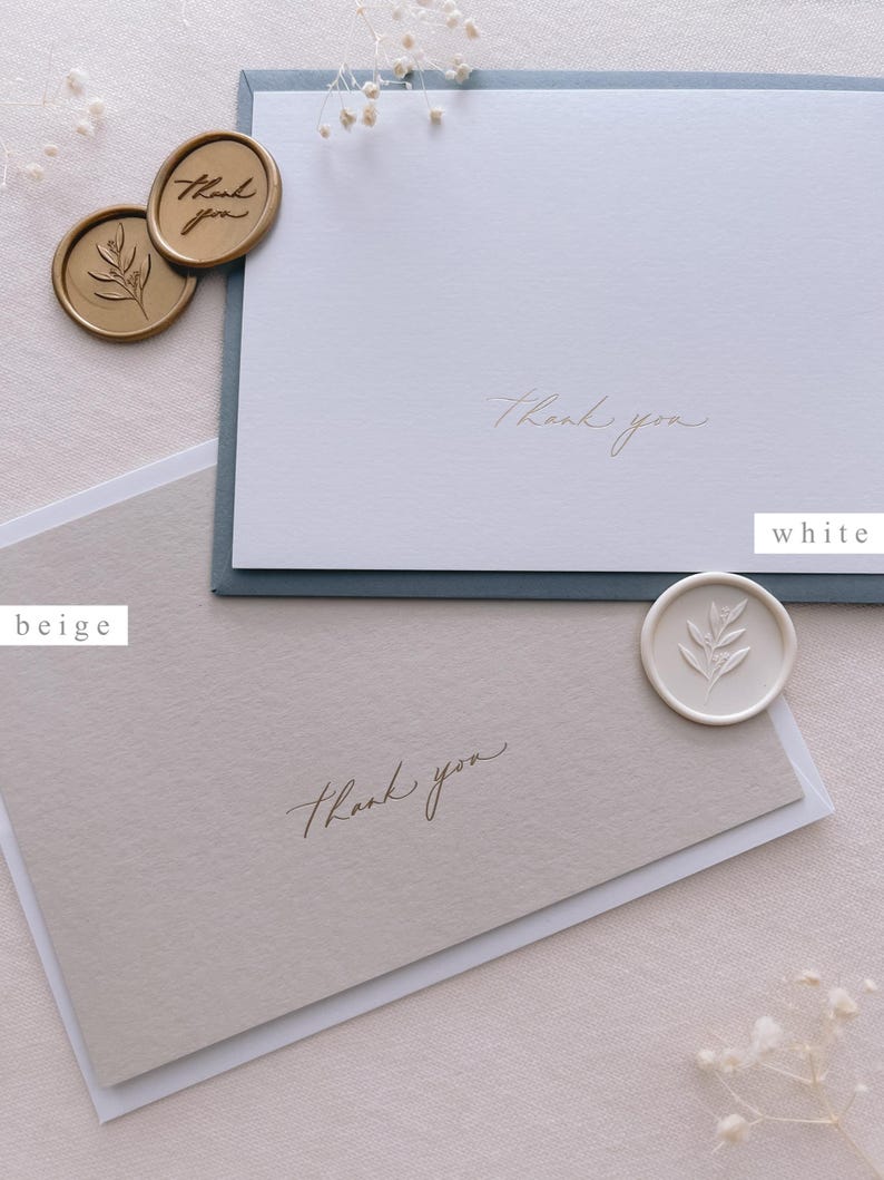 beige and white thank you note cards gold foil printed, accompanied with envelopes and wax seals