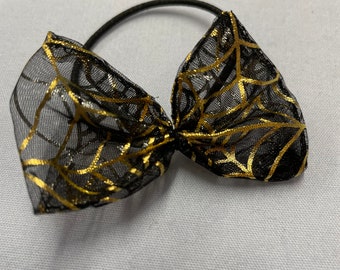 Golden cobweb bow band.