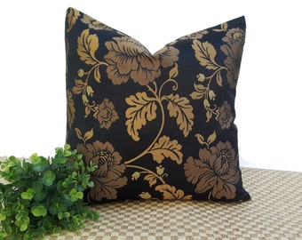 May include: A black and gold floral cushion cover with a large floral pattern. The cushion cover is made of a soft, luxurious fabric.