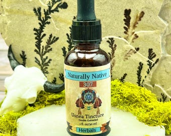 May include: A brown glass bottle with a dropper top, labeled "Naturally Native 307 Usnea Tincture Double Extracted 1 fl. oz/30 ml Herbals".