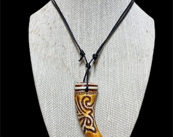 Faux Resin Tooth pendant with carved design details. adjustable cord necklace jewelry. unisex apparel
