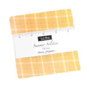 May include: A stack of yellow fabric squares with a plaid pattern, wrapped with a white band featuring the text "Summer Solstice Wovens." A ruler is included on the band. The fabric is from "Pieces to Treasure."