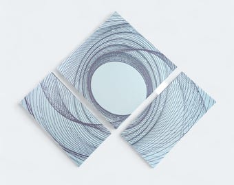 May include: Four light blue geometric wall art pieces arranged in a diamond shape. Each piece has a dark blue spiral design, with a central circular opening. The artwork is set against a white background.