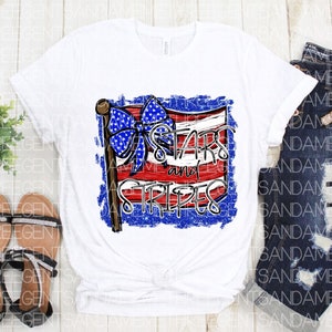 May include: White t-shirt with a distressed American flag design and the text "Stars and Stripes".
