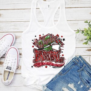 May include: White tank top with a red, white, and green graphic that says "Wheelie Baseball" with a baseball and bat. The graphic has red glitter accents and stars.