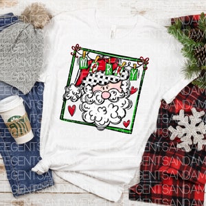 May include: White t-shirt with a black and white illustration of Santa Claus with a red hat and beard. The illustration is framed in green and has the word "Merry" written on it.