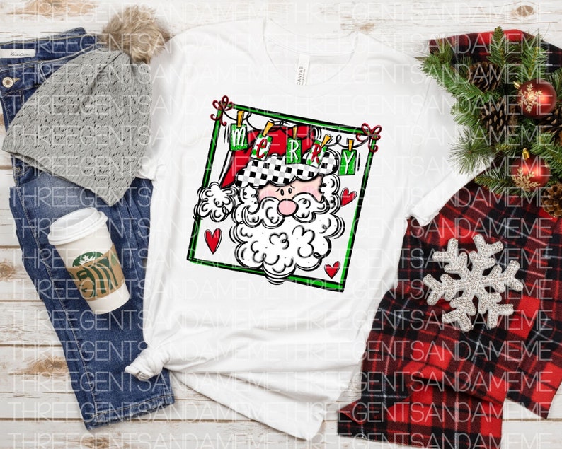 May include: White t-shirt with a black and white illustration of Santa Claus with a red hat and beard. The illustration is framed in green and has the word "Merry" written on it.