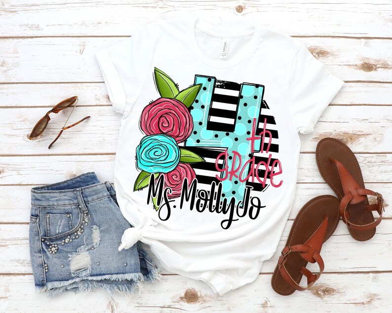 May include: White t-shirt with a black and white striped circle design. The circle has a large blue and pink flower design with a number 4 in the center. The text "4th Grade" and "Ms. Molly Jo" are written in black.