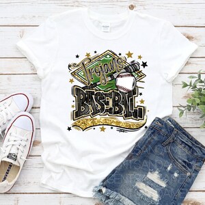 May include: White t-shirt with a green and gold baseball graphic that says "Trojans Baseball".