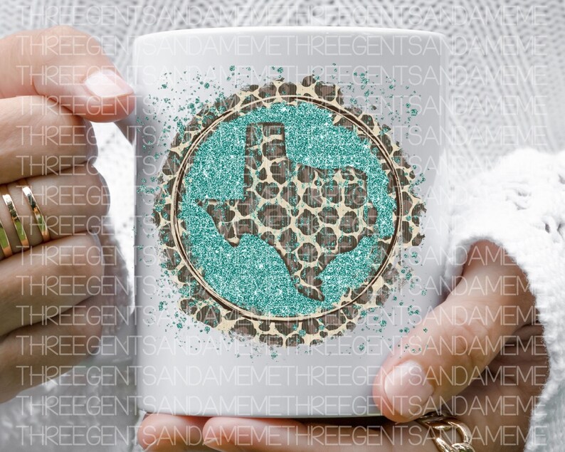 May include: White ceramic mug with a teal glitter and leopard print design of the state of Texas.