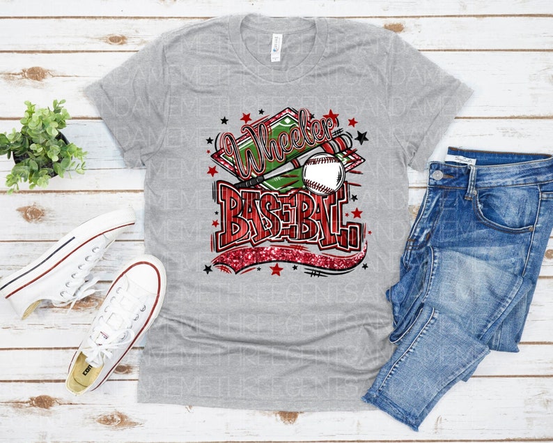 May include: Gray t-shirt with a red, white, and green graphic that says "Wheeler Baseball" with a baseball and bat.