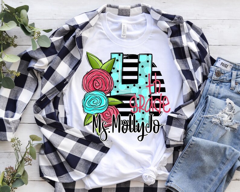 May include: White t-shirt with a black and white striped background, a blue and pink floral design, and the text "4th Grade Ms. Molly Jo".
