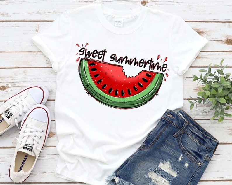 May include: White t-shirt with a red and green watermelon graphic and the text "Sweet Summertime".
