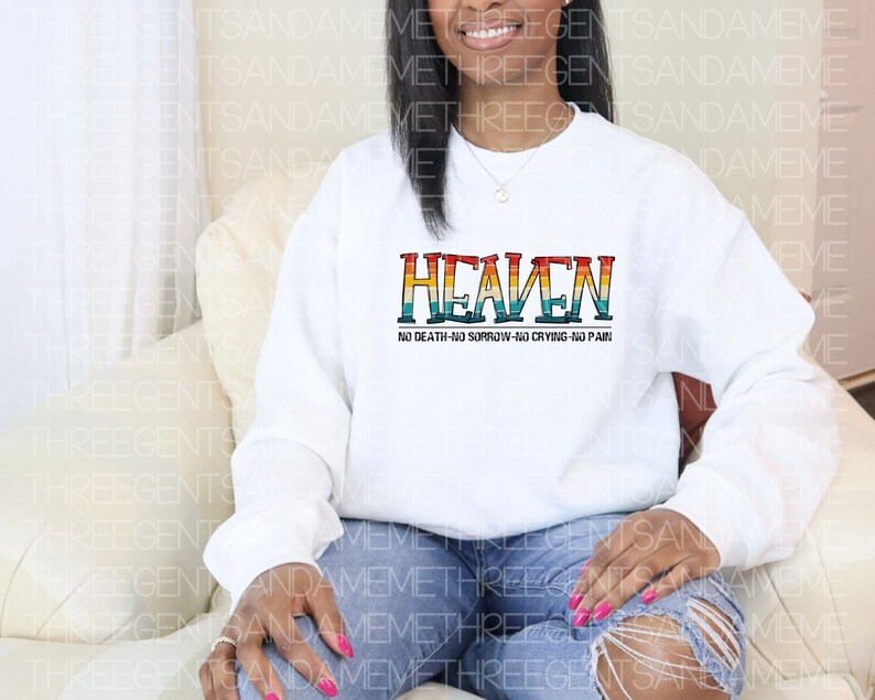 May include: White sweatshirt with a rainbow colored graphic that says "Heaven" and "No Death-No Sorrow-No Crying-No Pain".